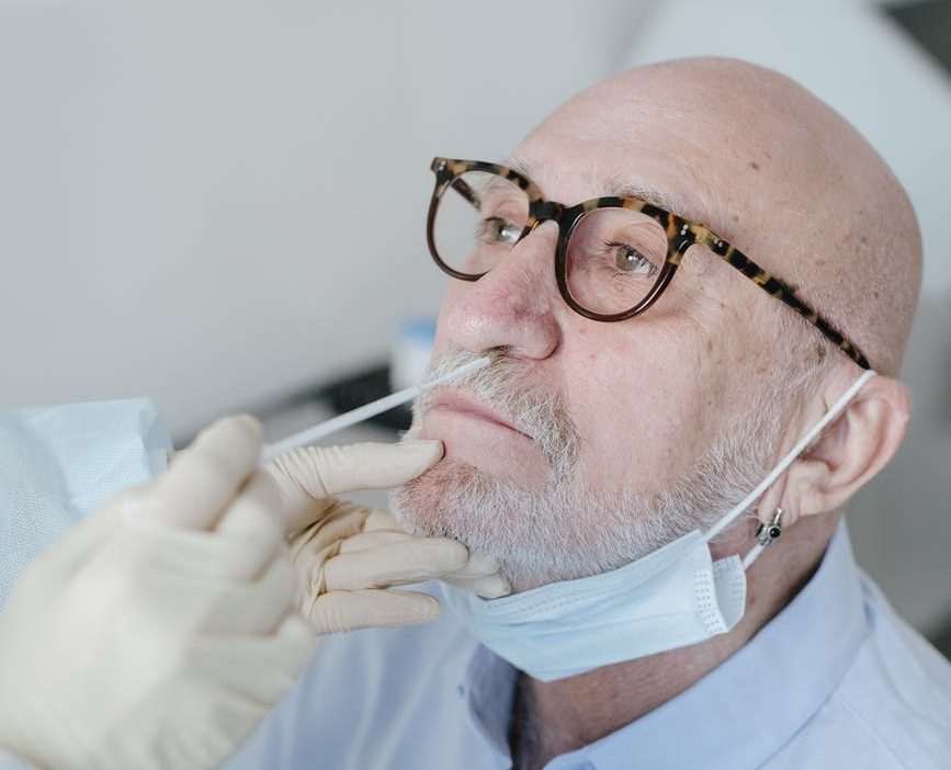 a person doing nasal swab test