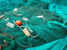 fishing net with crumpled textile and buoys