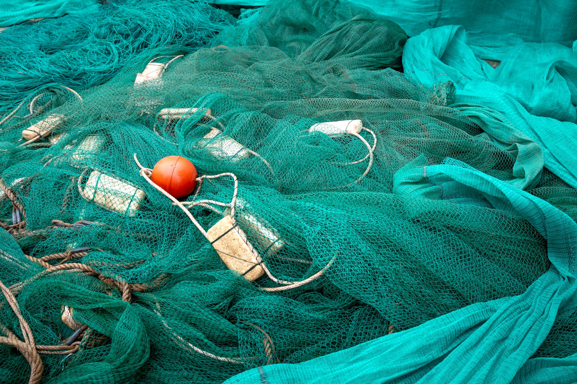 fishing net with crumpled textile and buoys